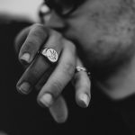 grayscale photo of man and woman wearing rings